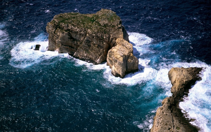 Rocky islands in the ocean with waves