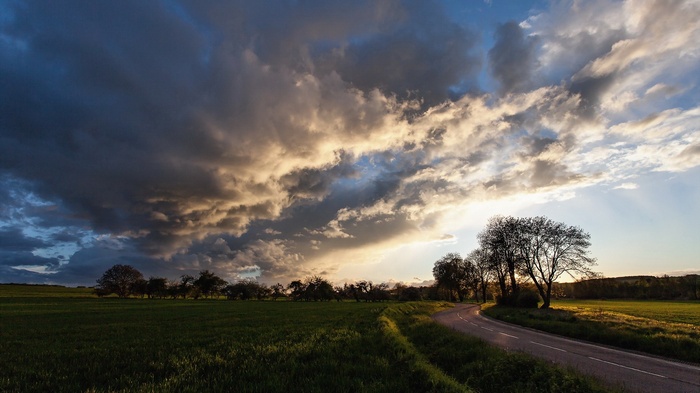 Stormy Sky Over a Country Road and Field