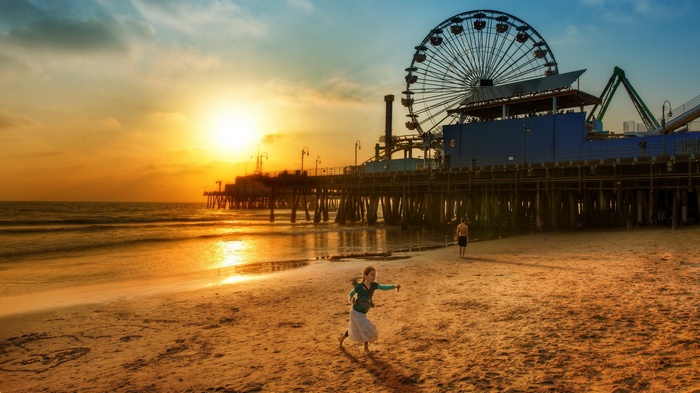 Santa Monica Pier at Sunset with Children on Beach