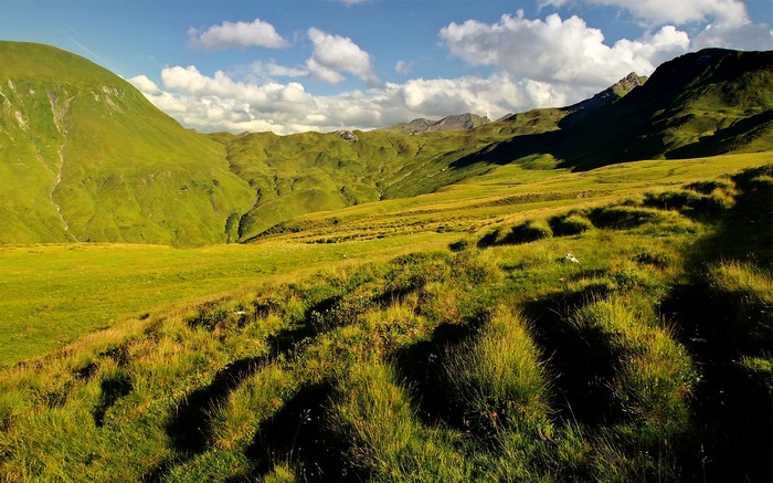 Green mountain landscape with clouds