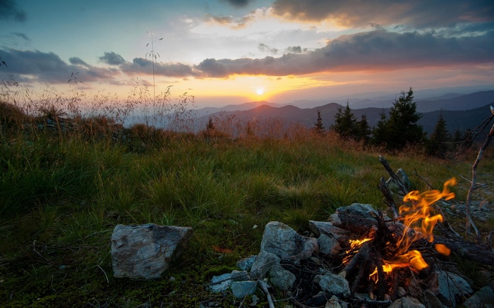 Campfire at sunset in the mountains