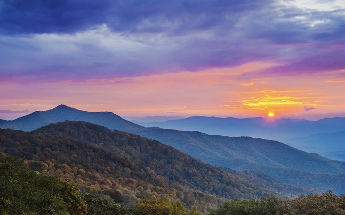 Mountain range at sunset with colorful clouds