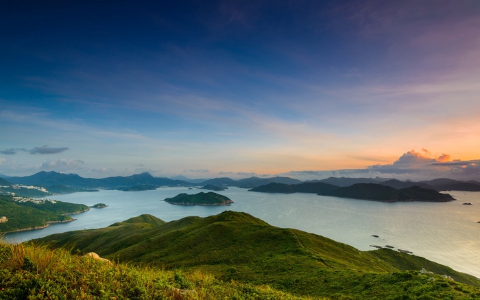Panoramic view of islands and sea at sunset