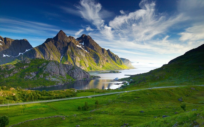 Mountainous coast with a calm bay and a boat