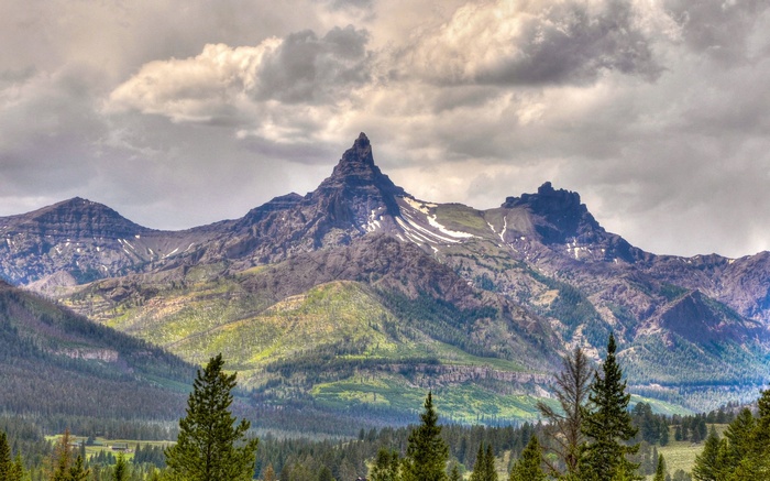 Jagged mountain peak under cloudy sky