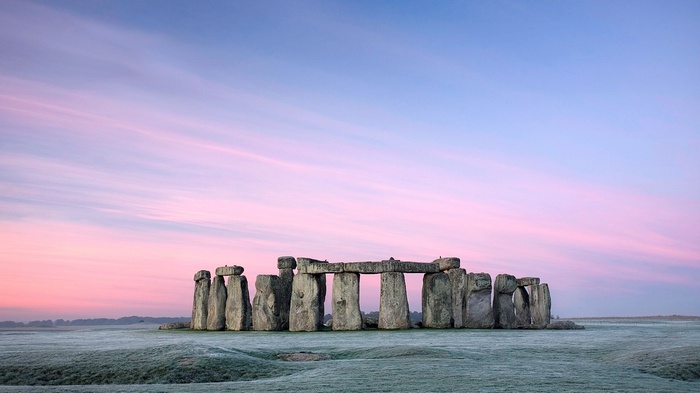 Stonehenge at sunrise with pink and blue sky