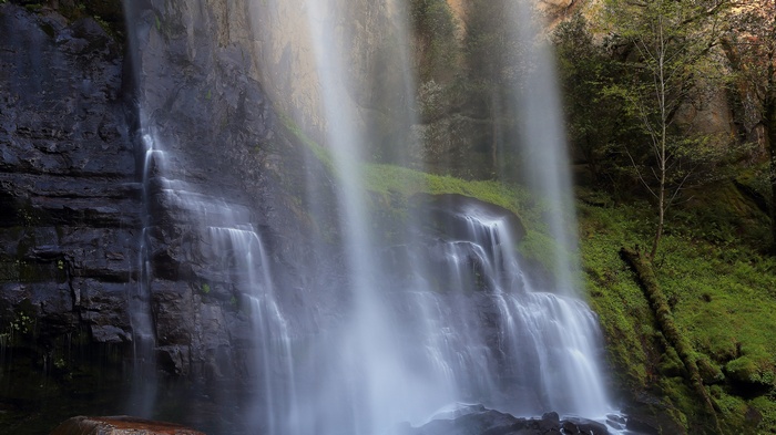 Waterfall cascading down a rocky cliff face
