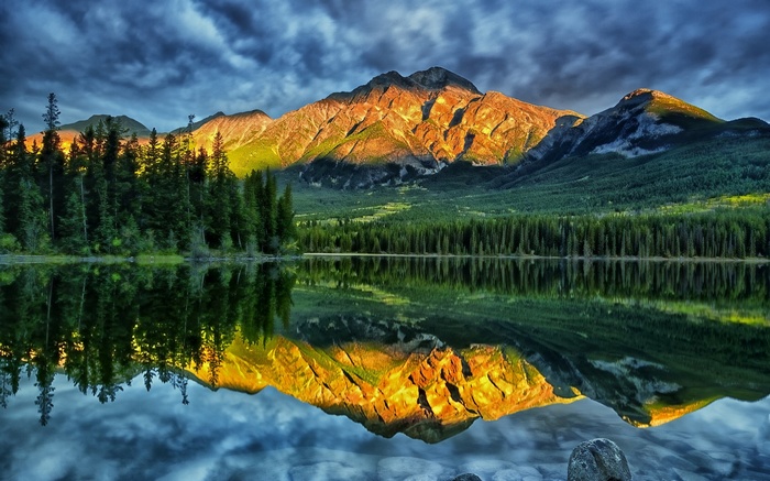Mountain reflected in a calm lake at sunset