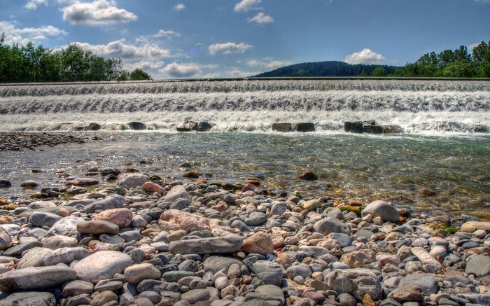 River with a waterfall and rocky shore
