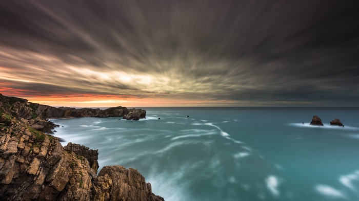 Long exposure of a rocky coastline at sunset