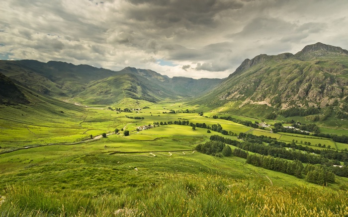 Green Valley with Mountains and Winding Path