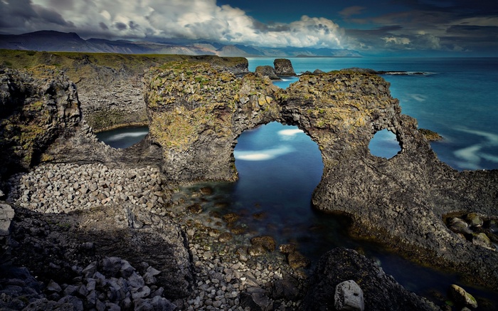 Natural rock arch over the ocean in Iceland