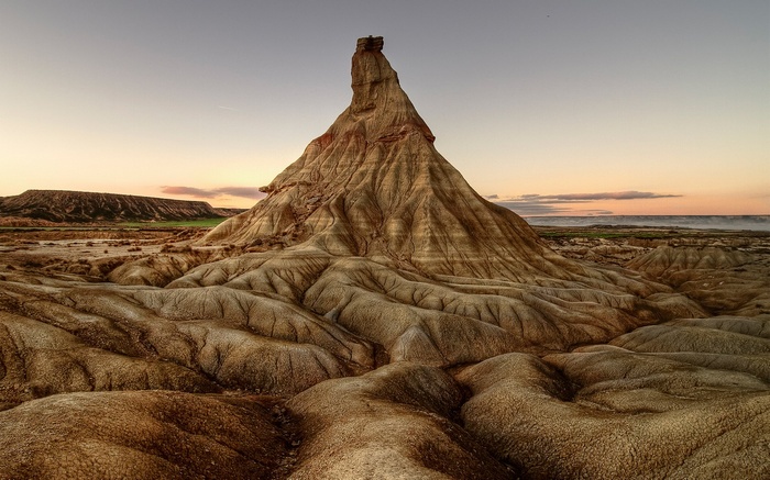 Desert landscape with rock formations at sunset
