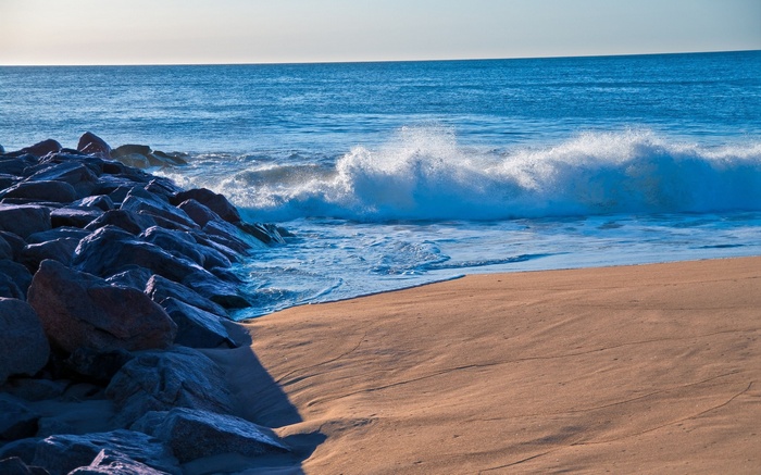 Ocean waves crashing on a rocky beach