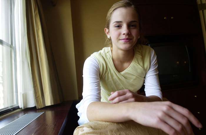 Emma Watson sitting near window with soft light