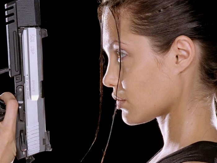 Angelina Jolie holding a gun