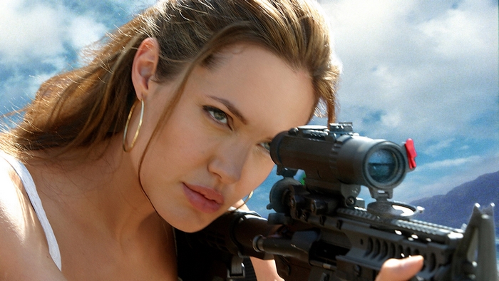 Angelina Jolie Aiming Through Rifle Scope Outdoors