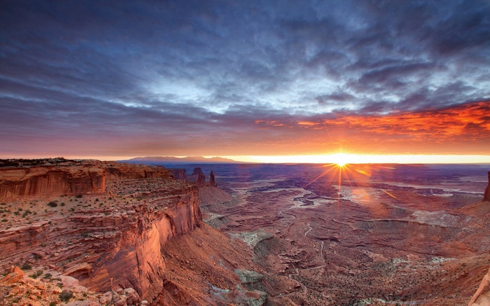 Sunrise over a desert canyon landscape