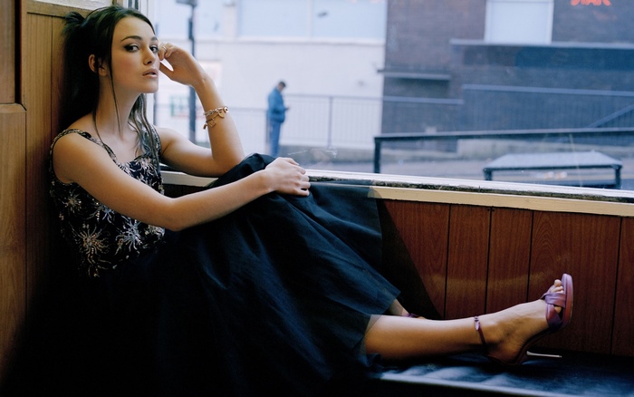 Keira Knightley sitting by a window