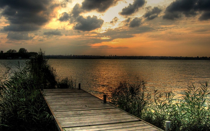 Wooden pier on a lake at sunset