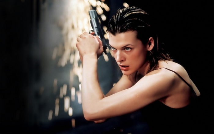 Milla Jovovich holding a gun with sparks