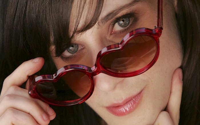 Zooey Deschanel wearing heart-shaped sunglasses