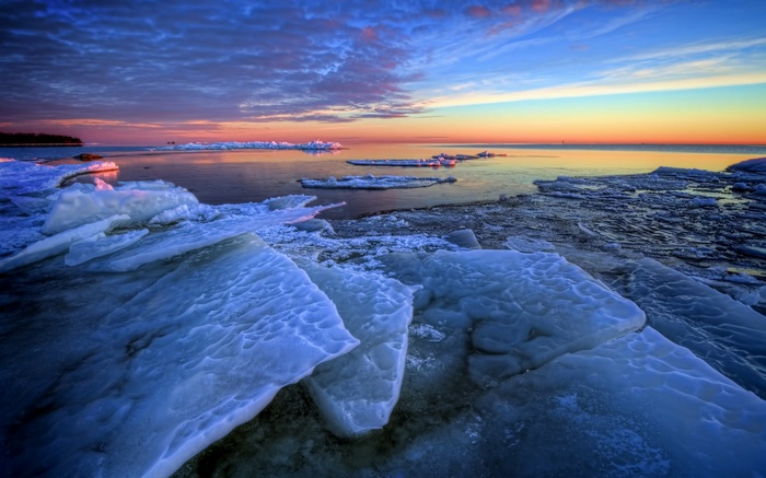 Ice floes on a lake at sunset