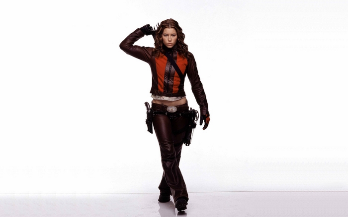 Jessica Biel in leather outfit with guns