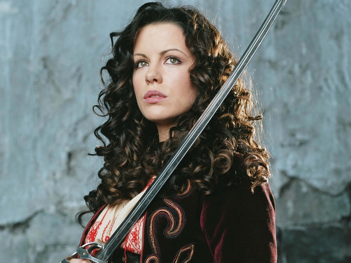 Kate Beckinsale holding a sword