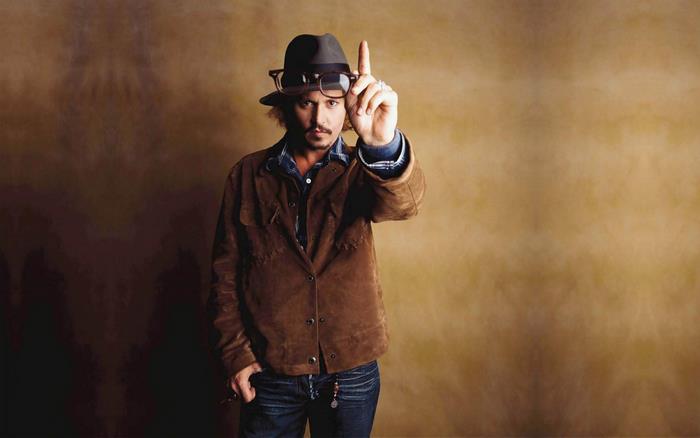 Johnny Depp wearing a hat and glasses