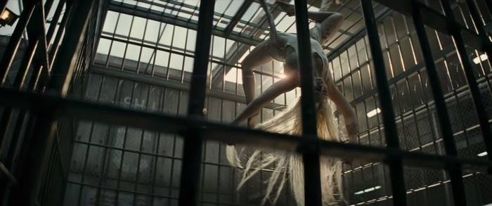 Margot Robbie in a cage