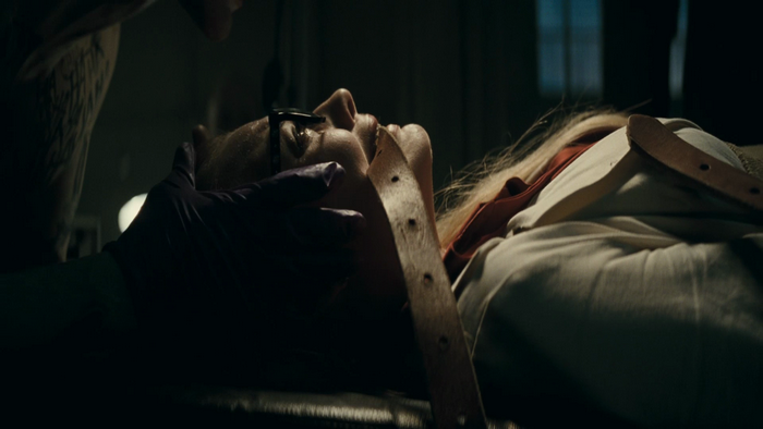 Margot Robbie in a medical restraint