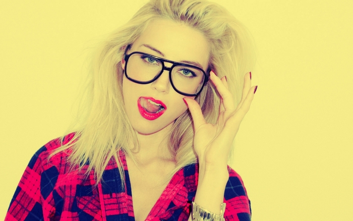 Amber Heard wearing glasses and plaid shirt
