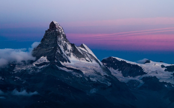 Matterhorn mountain at twilight with pink and blue sky