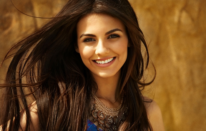 Victoria Justice smiling with long brown hair