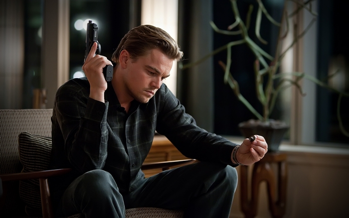 Leonardo DiCaprio holding a gun