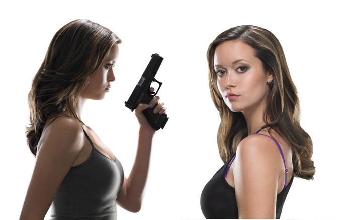 Summer Glau holding a gun