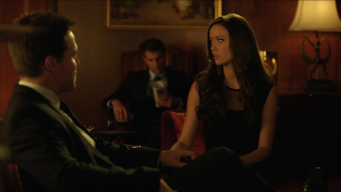 Summer Glau and two men in a dimly lit room