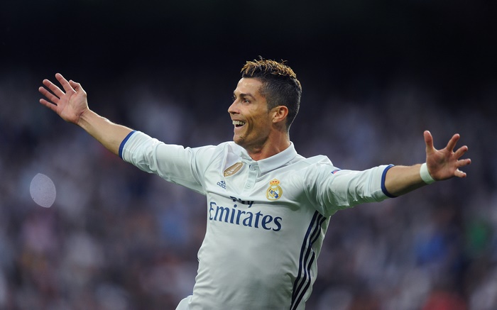 Cristiano Ronaldo celebrating in a Real Madrid jersey