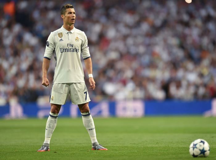 Cristiano Ronaldo Poised for a Free Kick in White Kit
