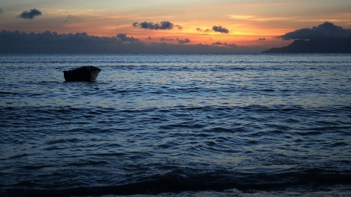 Boat on the water at sunset