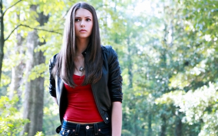 Nina Dobrev in a black jacket and red top