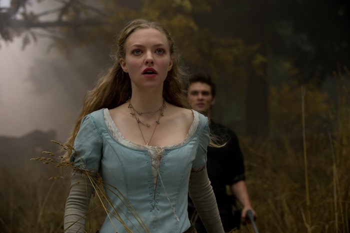 Amanda Seyfried in a blue dress in a forest