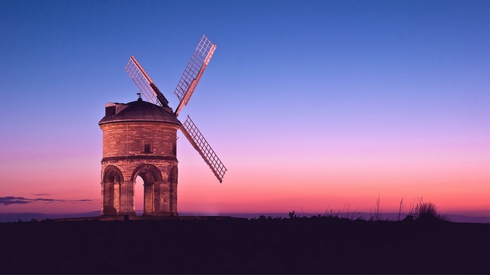 Windmill at sunset with colorful sky