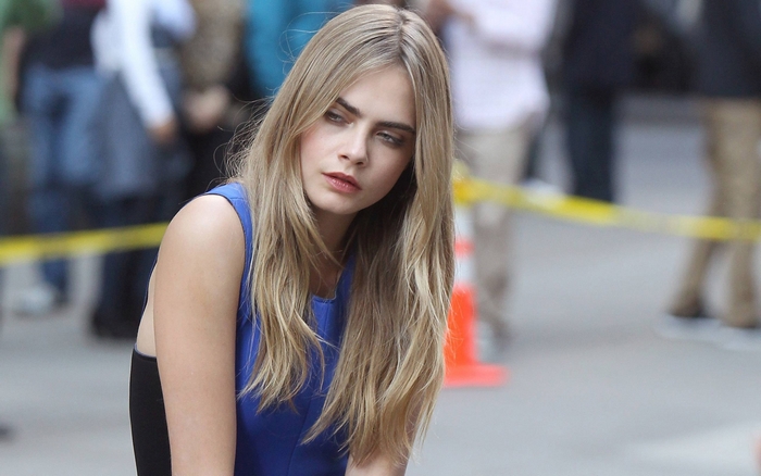 Pensive Cara Delevingne in Blue Dress Outdoors