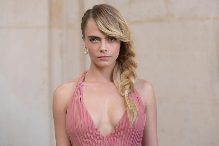 Confident Cara Delevingne in Pink Dress With Braided Hair
