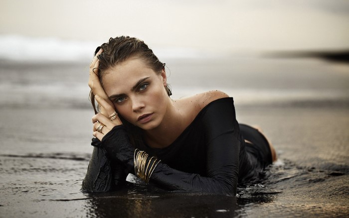 Cara Delevingne on a beach