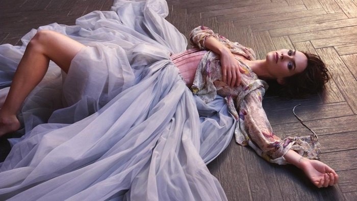 Lena Headey lying on wooden floor