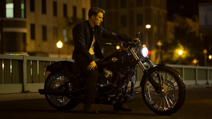 Chris Evans on a motorcycle at night