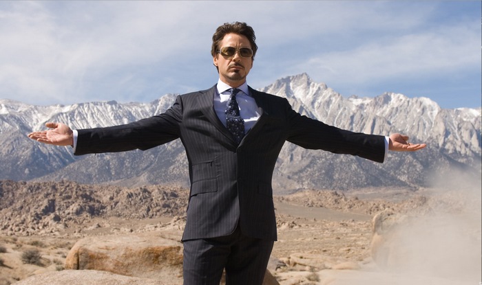 Tony Stark in a suit with arms outstretched